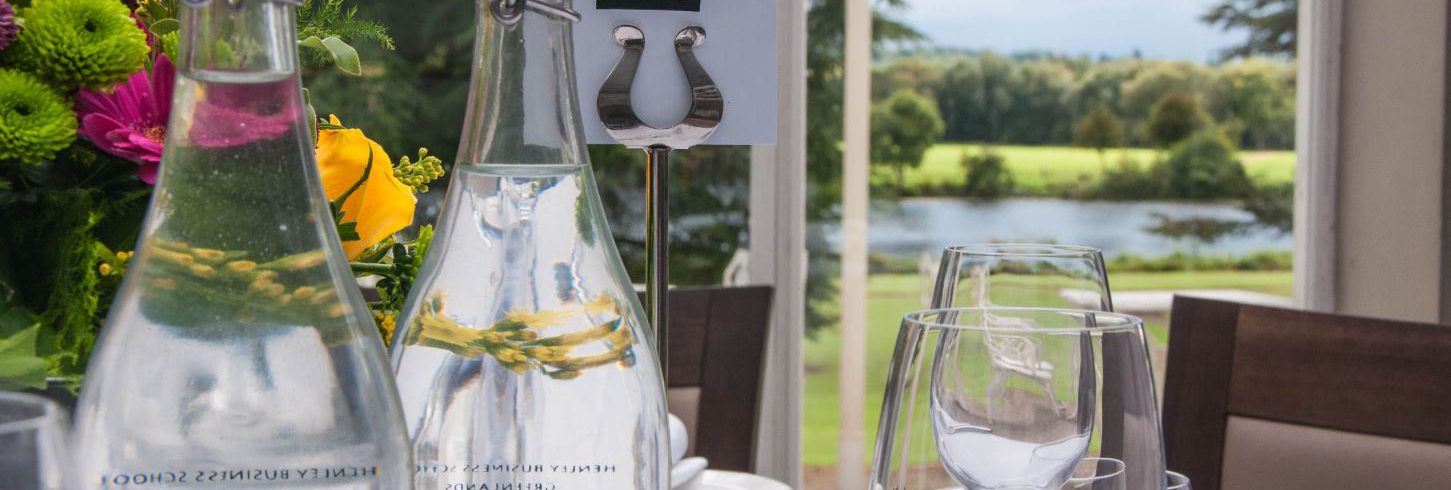 A photo of Henley Greenlands heyworth restaurant table with glass water bottles