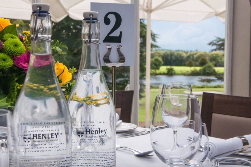 A photo of Henley Greenlands heyworth restaurant table with glass water bottles
