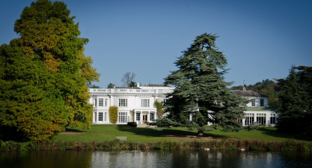 A photo of Henley Greenlands white building from the River Thames