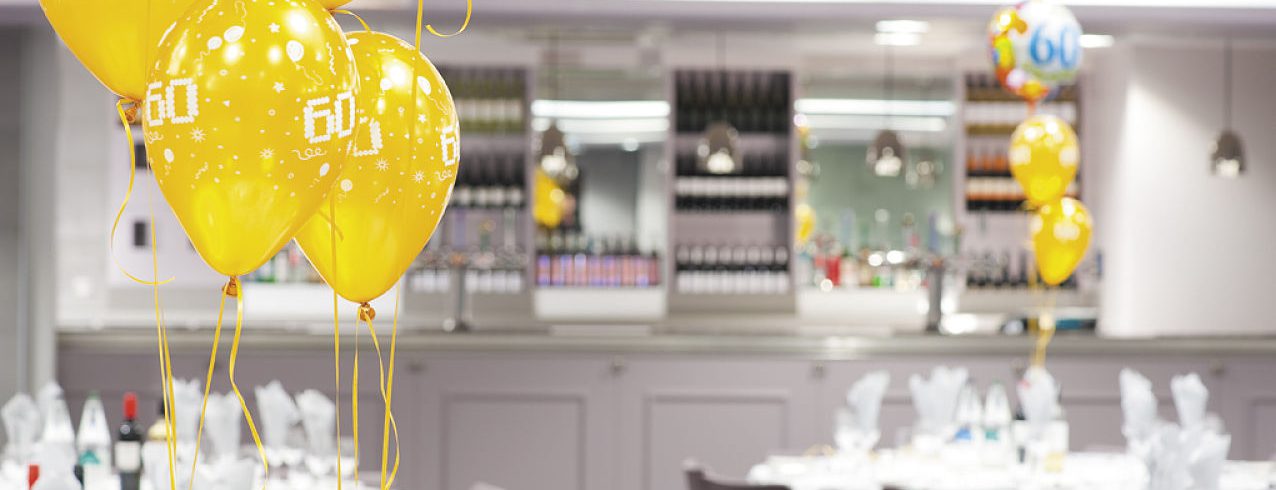 A photo of Meadow Suite with 60th birthday balloons