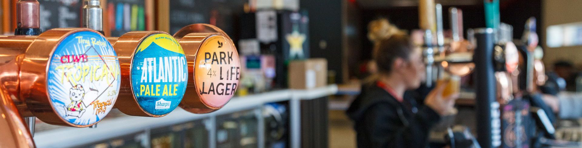 A close-up photo of Park Bar beer taps