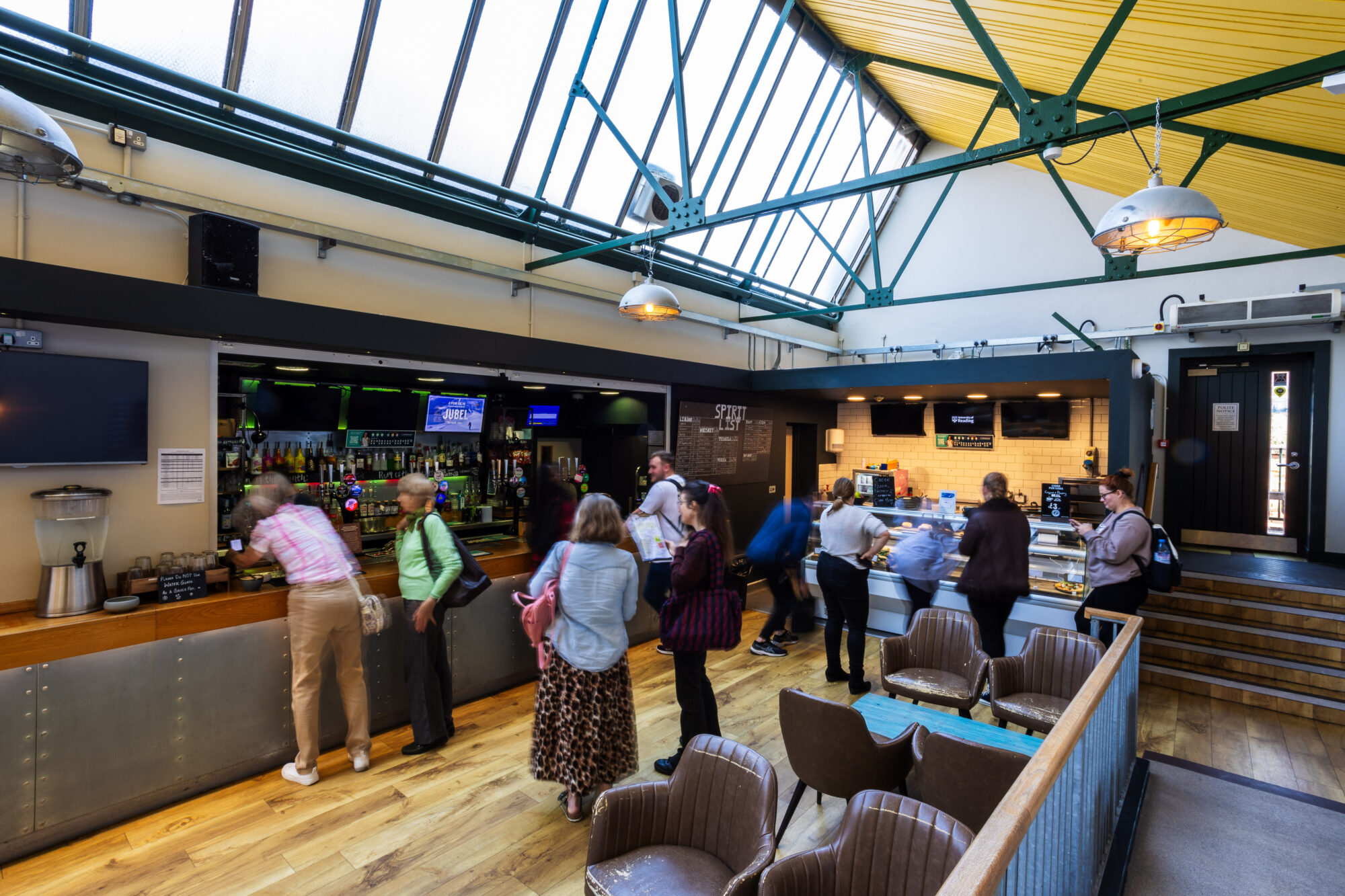 People Queuing for the Bar
